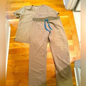 Figs tan colored set- size large- used very good condition.